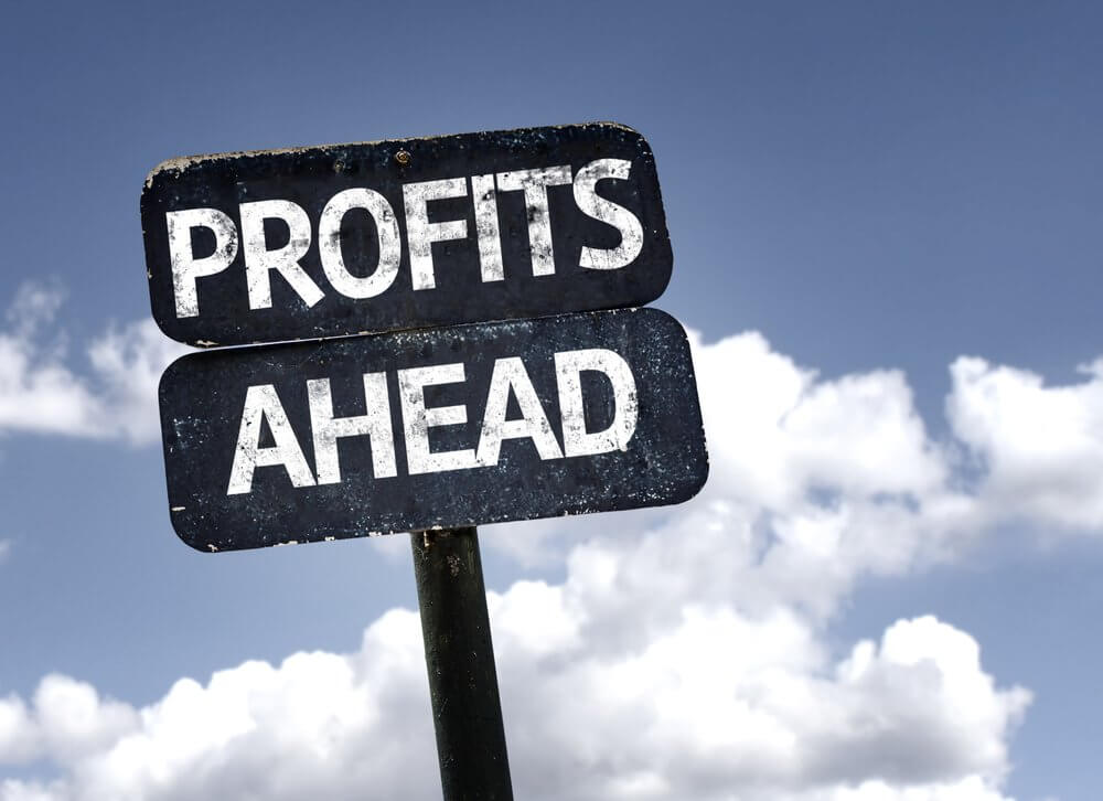 Profits Ahead sign with clouds and sky background